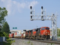 CN 2877, CN 2267 & CN 8860 (with CN 2843 mid-train) lead CN 120 on the Montreal Sub with a long string of containers bound for Halifax.