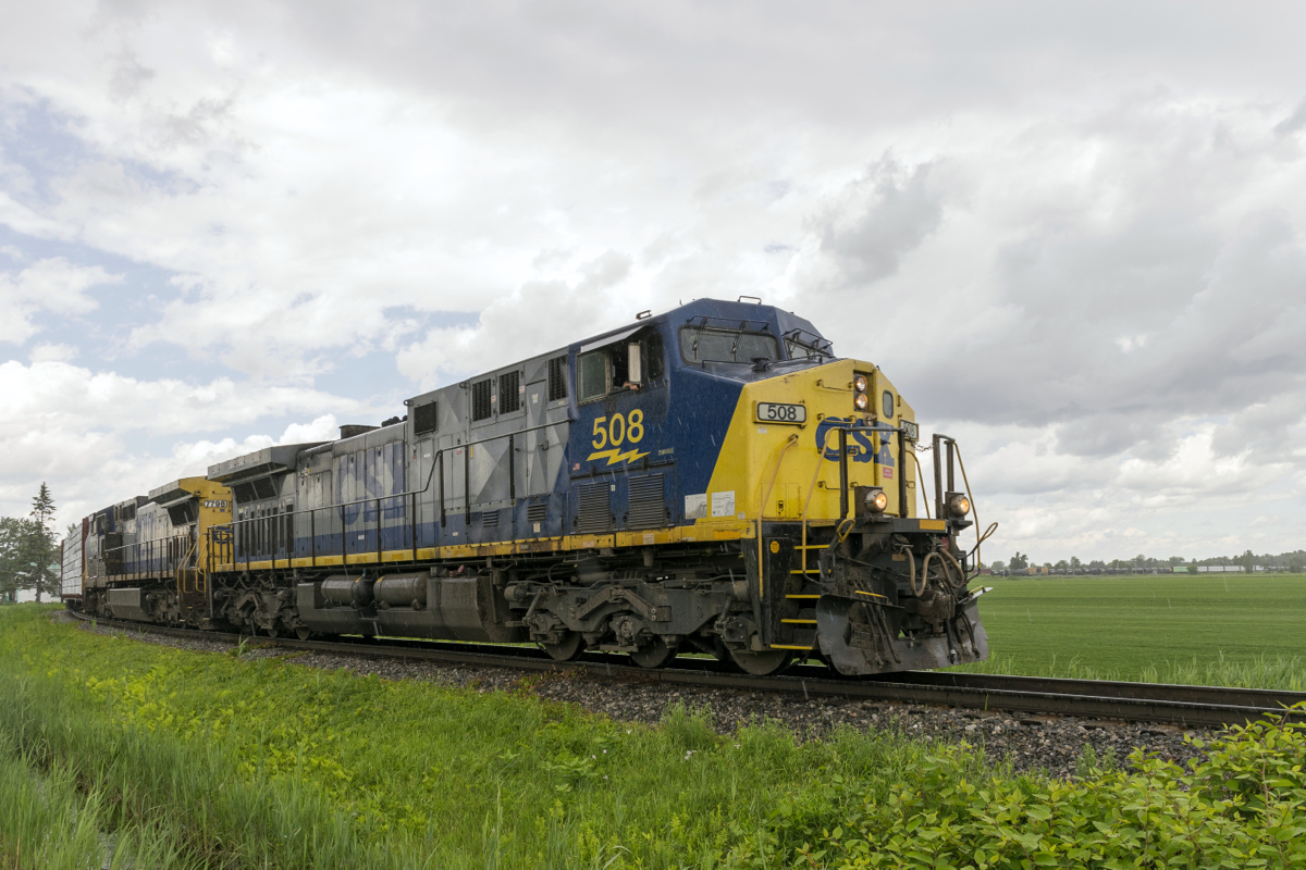 A pair of YN2 GE's (CSXT 508 & CSXT 7798) lead CN 327 off the Kingston Sub and onto the Valleyfield Sub just after it started to pour.