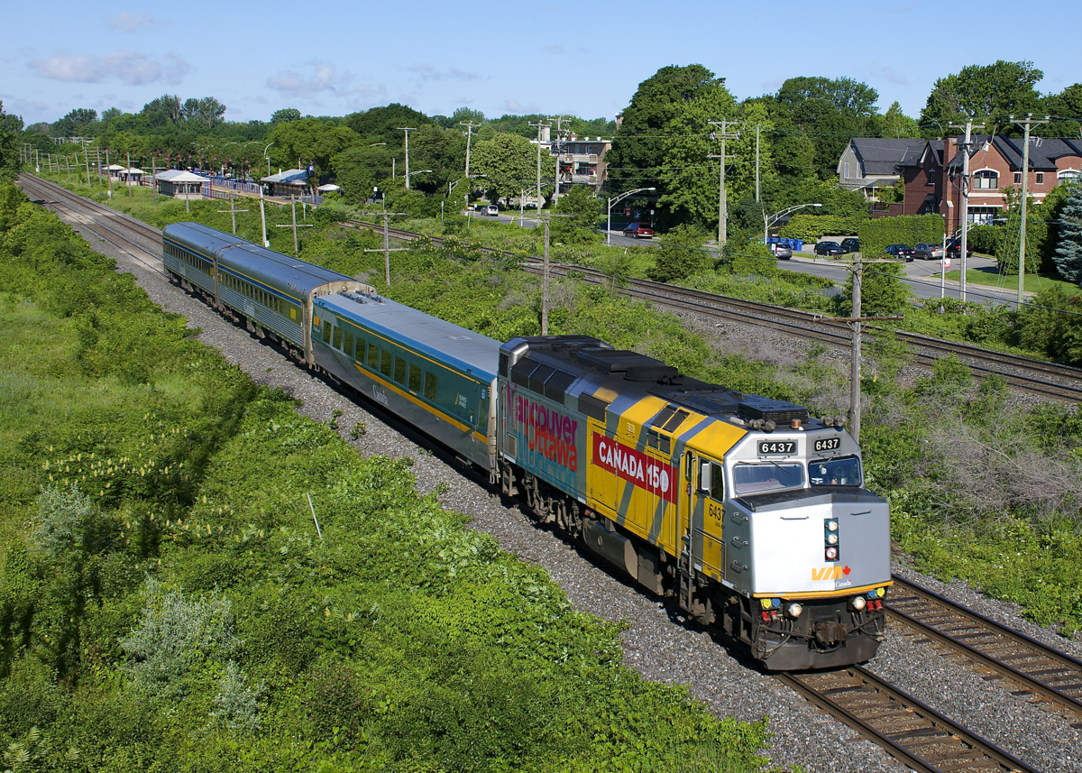 Canada 150 unit VIA 6437 leads VIA 22 eastbound, with its next stop at nearby Dorval Station.