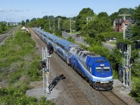 As far as I know, AMT 41 is the only trains on the Vaudreuil-Hudson line to not go as far as Vaudreuil and the only one to not make all stops. It leaves Lucien L'Allier Station in downtown Montreal at 0750 and only makes stops at Vendome, Montreal West, Lachine, Dorval and Pointe-Claire before stopping at Beaconsfield at 0820. It lays over there before heading back east twenty minutes later as AMT 40. Heading east it makes all stops on its way back towards downtown. Here AMT 41 passes through Pointe-Claire with AMT 1354 pushing, soon it will pass Cedar Park Station without stopping.
