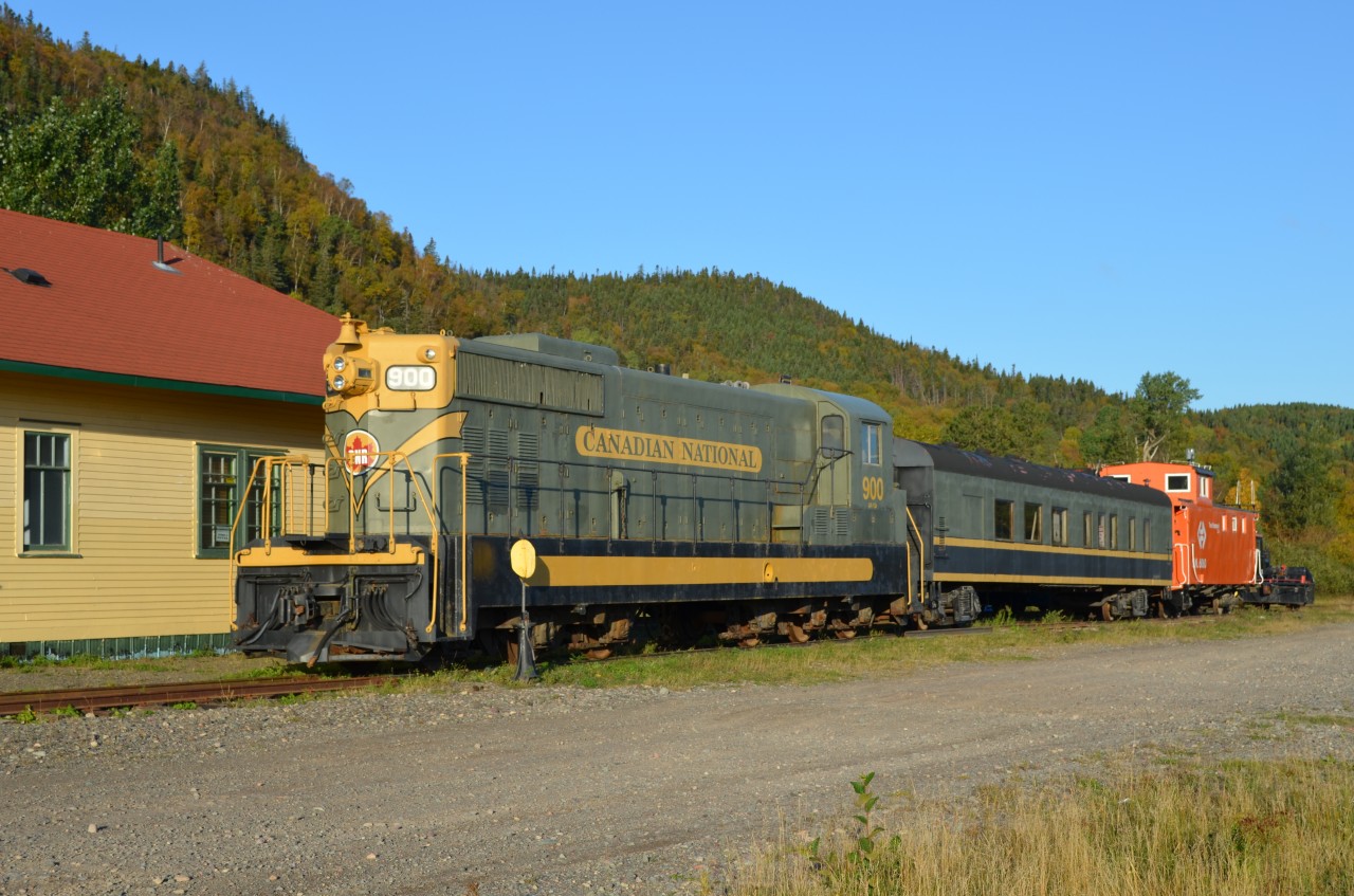 CLARENVILLE COLLECTION. NF110 # 900 lives on as a static display at the Clarenville Heritage Society on the beautiful early autumn morning of October 10, 2013. Built by GMD in 1952 and with a CN Class of GR-12-a, it and her 1200 HP sisters 901 and 902 were the first of the type to arrive in Newfoundland to start replacing the Mikado and Pacific steam engines still operating on the Island's narrow gauge railway. Beautifully restored to her glorious green and gold paint scheme by the Society, this engine also accompanies Diner 176, the last diner ever built in Canada for the CNR in 1958 as well as Terra Transport Caboose 6061.
