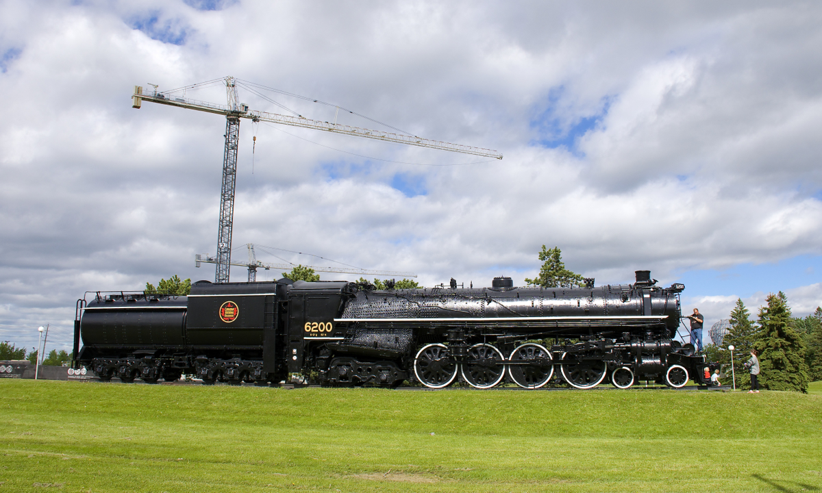 CN 6200 (a 4-8-4 Northern which is preserved on the grounds in front of the Canada Science and Technology Museum) continues to be refurbished, with a backup headlight added recently. I believe the two cranes in the background are related to work on the nearby Canada Science and Technology Museum, which has been closed for a number of years but is supposed to reopen in the fall.