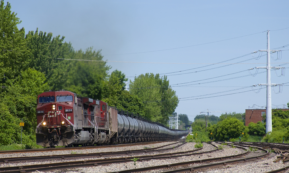 CP 650 has AC4400CW's CP 8614 & CP 9646 for power (both in the 'beaver' paint scheme) with 96 ethanol loads and SOO Line buffer cars at each end as it passes the perenially empty Lasalle Yard.