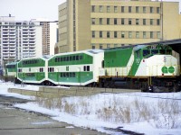 In response to a suggestion I post a 3/4 view in lieu of the head on shot submitted recently (#29760)of GO Transit running a pair of new Bi-Level cars for public inspection to the TH&B station in Hamilton, well, here it is. In this image, as the other, the display is just being set up. It was a busy afternoon, and the showing went over well. The APCU I think is 905. So it looks.