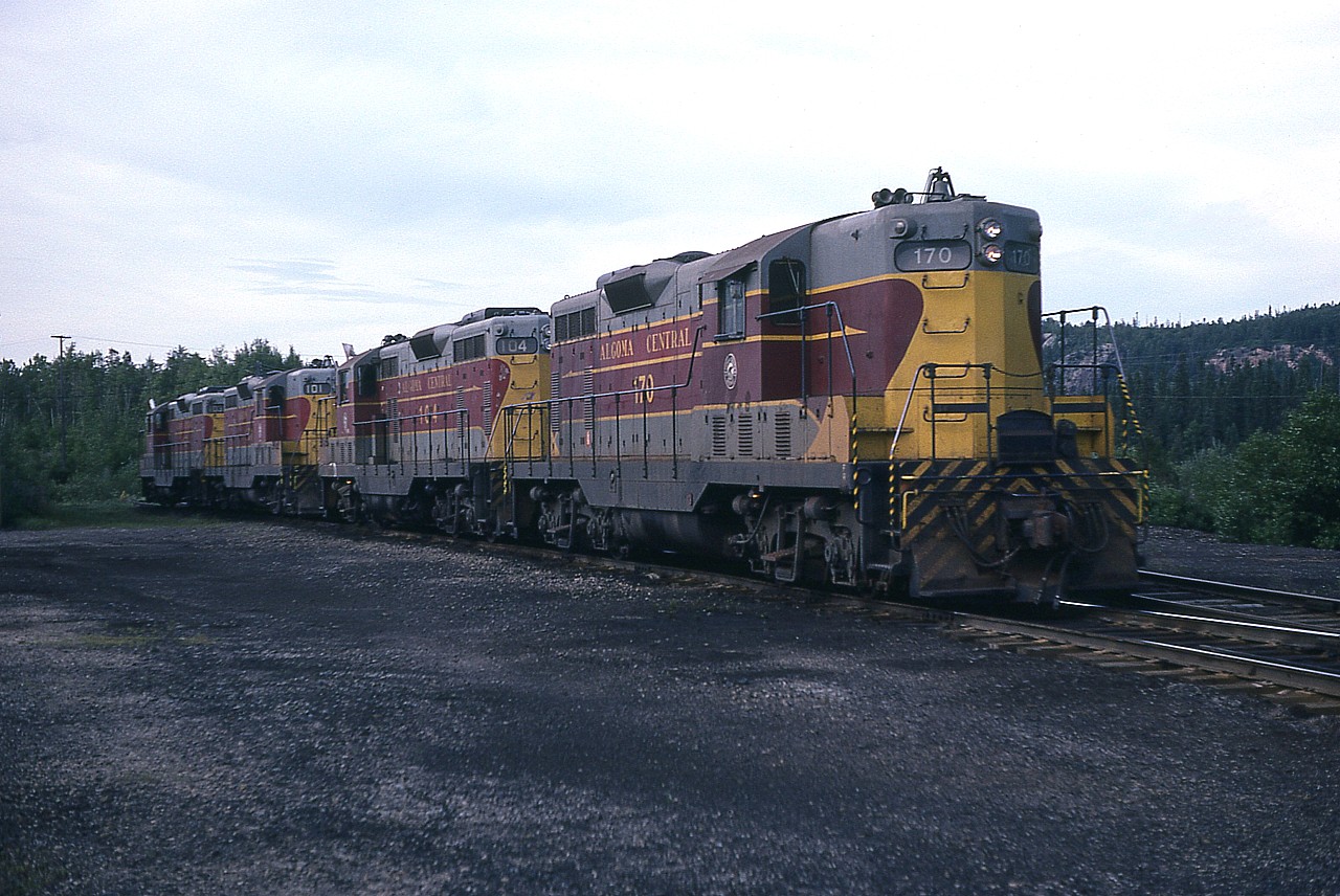It would still be another 10 years before these classic AC units would become part of the Wisconsin Central takeover and lose the identity we fondly always remember them having.  On the easternmost track outside the enginehouse at Hawk Jct we see AC 170, 104, 101 and 103. Note the the second and the fourth unit still sport 'extra' flags. This set of locomotives after 1994 became WC 1508, 1504, 1503 and 1502 respectively. (there was no #102 at WC takeover, it was scrapped in 1993 after a wreck)