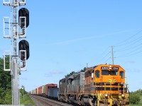 GEXR train 432 is seen rolling eastward past the signals at Mount Pleasant on CN's Halton subdivision. Today's consist has QGRY 6908, a SD40-3 that started life as a CN unit in mid consist, while the "tunnel motor" trails. 
