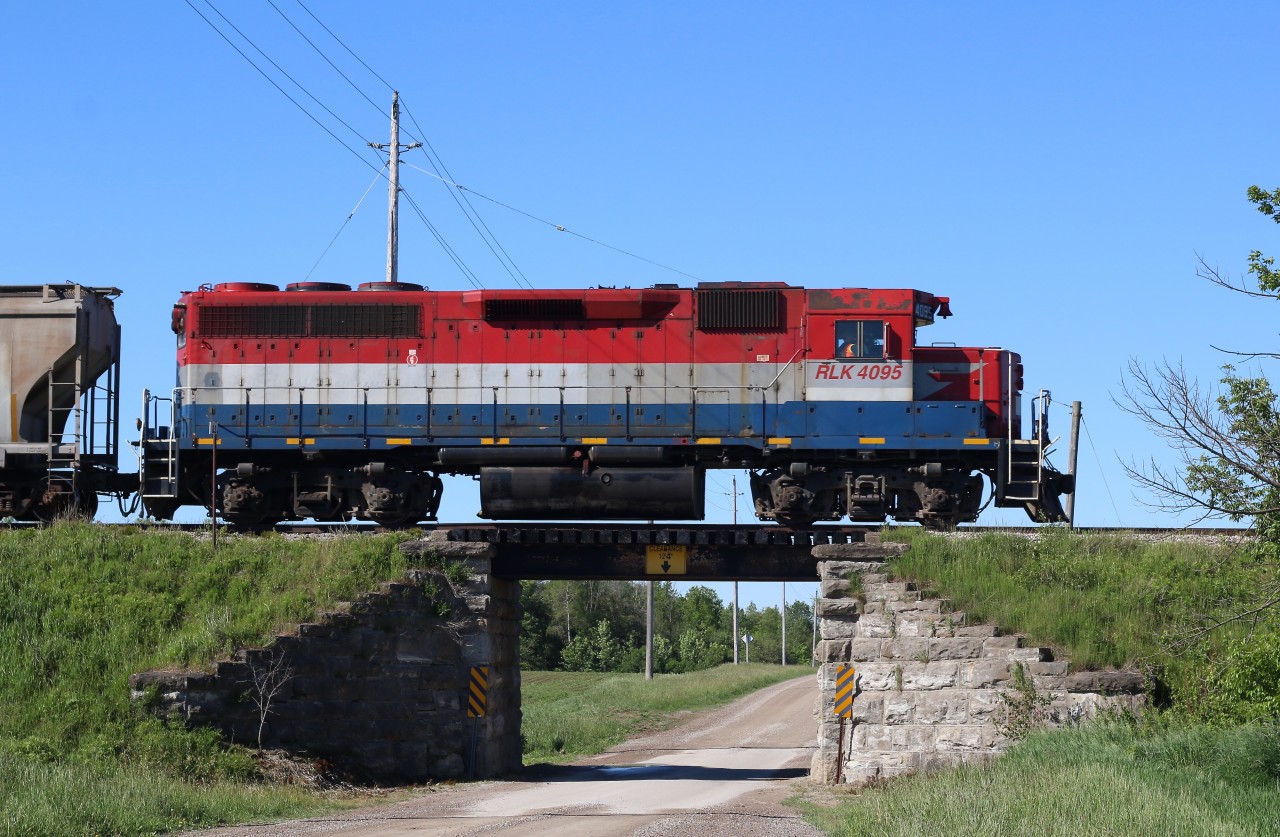 After reading a post on line last night regarding Genesee Wyoming making a deal to trade a large group of GP40 into MEI Industries in return for rebuilt GP38s, my chase of GEXR 581 today seemed fitting. I'm not sure at this time which GP40 units will be traded in but their is a good possibility that old RLK 4095 will be one of them. The one time CN unit always seemed at home on the former CN lines out of Stratford and if she leaves the property, she will surely be missed. Today she handled train 581 alone and traveled to Clinton then onto Hensal to work the elevators there. I've alway liked this old bridge east of Mitchel, hard to find one these days without hand rails obstructing the shot.