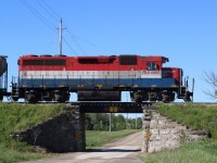 After reading a post on line last night regarding Genesee Wyoming making a deal to trade a large group of GP40 into MEI Industries in return for rebuilt GP38s, my chase of GEXR 581 today seemed fitting. I'm not sure at this time which GP40 units will be traded in but their is a good possibility that old RLK 4095 will be one of them. The one time CN unit always seemed at home on the former CN lines out of Stratford and if she leaves the property, she will surely be missed. Today she handled train 581 alone and traveled to Clinton then onto Hensal to work the elevators there. I've alway liked this old bridge east of Mitchel, hard to find one these days without hand rails obstructing the shot.