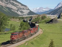 A manifest train on a beautiful spring morning. This train has just past the Frank Slide, where in 1903 a big part of Turtle mountain came crashing down on the town of Frank. You can see the large rock pile near the top of the photo. No matter how many times I drive by it over the years, it always looks like it just happened. 