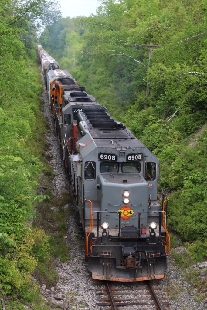 The Goodrich Exeter's newest arrival SD40-3 #6908 has added a little more variety to a roster that is gradually fading away to GW orange. although the unit was built decades ago for Canadian National it has since been rebuilt with an upgraded electrical system by Alstom and is probably one of the most up to date units on GEXR's roster. This overhead view shows off some of the units details specifically ordered by CN, from its snow shields, to two colour class lights, since plated over above the number boards. The notch cut out above the former bell location was to eliminate clearance issues with the horn, since relocated as well. Today's trio of SD's are digging hard into the beginning of their climb up the escarpment as they head west for Stratford.