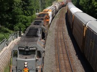 I've always had a thing for CN's standard cab SD40s. My early years of photography was spent chasing down the last survivors along with their rebuilt counterparts. (When I wasn't out chasing the last Alco's :) Borrowed QGRY SD40-3 6908 has been a nice addition to the GEXR's roster and brings back fond memories of chasing the former CN SD40s rebuilt by Alstom. Friday proved to be a bit challenging on the Halton subdivision with an eastbound going into emergency at Peel at the wrong time with trains all around it. GEXR 431 has finally broken free of the back log as it sails off the Halton subdivision and onto the Guelph sub. at silver in Georgetown's west end. The zig-zag near the old station may one day be realigned, but for now it remains to remind us of when the station required its own service track. The train is seen here just about to begin it climb up the Niagara Escarpment.