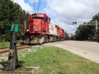 As heavy clouds roll in local T14 finishes running around its train at Streetsville, with a well weathered SOO GP38 leading a former sister SOO unit. From here the crew will keep busy into the afternoon switching out the former PDI facility at the junction before heading home to Toronto.