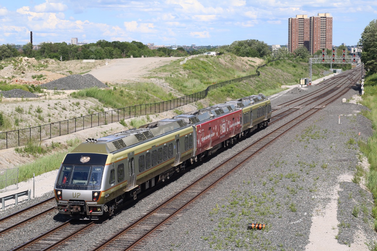 While the Union Pearson Express doesn't typically excite me too much, I found myself in the right place at the right time, and with Canada's 150 birthday quickly approaching I had to make an effort to snag at least one of the wrapped UP units. My sons both love the UP so after a birthday party we we off to the Islington Ave overpass for a couple of quick shots. here we have UP 1001 leading a three unit consist along with a wrapped unit.