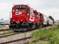 With Canada's 150 Birthday only one day away I found this shot today at Streetsville Junction fitting. Here we find former SOO Line GP38 4434 nicely decorated with a Canada flag as the crew of T14 grabs the last car left by the OBRY. After a quick break the train will head back to Toronto yard.