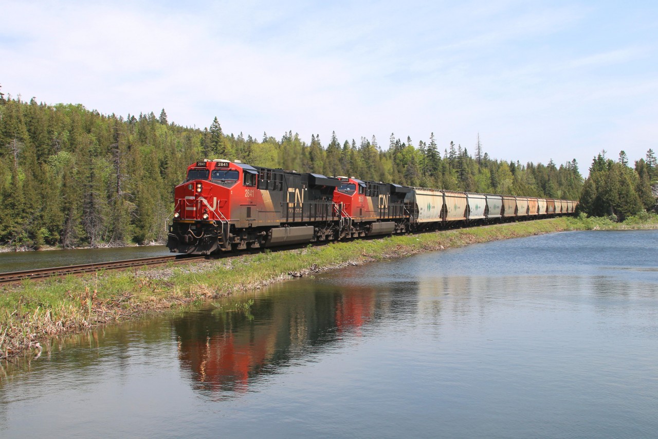 CN train B730, a unit Canpotex potash train, from Saskatchewan to Saint John NB is nearing its destination as it descends the grade in full dynamics just a few miles from Courtney Bay.  Leading on the head end is 2841 with 2850 and 125 cars back is in DP action 2958 and 2966.  The sun was shinning brightly today with the winds blowing at around 50kph.  Love this spot.