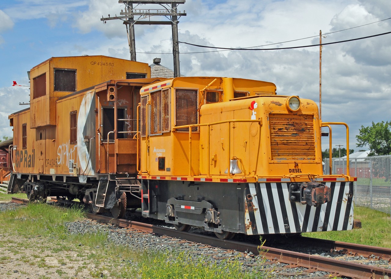 On display at the Portage la Prairie CP Station is ex Manitoba Hydro GE 25T # 857, with CP caboose 434560