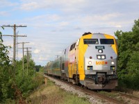 Canada 150 decorated VIA 909 passes the unused line side poles east of Acton as its Sarnia bound train races westward. It's a spot I don't photographer often as it's a bit tight, but the late day light this day helped to make the shot. 