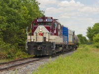Having missed OSR 1620 ad 1401 on their return trip back through Woodstock, the chase was on to catch them on their way to Ingersoll. I was lucky enough to be with Arnold Mooney on this trip, and we hot-footed it! Along the way, we were just ahead of the train, and I was given the opportunity of photographing it as we stopped roadside just outside of Beachville. Sadly, it was only one income car - the lone tanker. I wish they still used cabooses...it always added value to a short train!