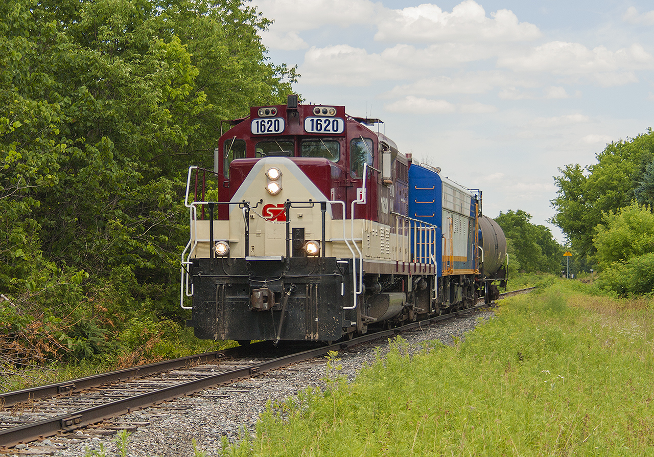 Having missed OSR 1620 ad 1401 on their return trip back through Woodstock, the chase was on to catch them on their way to Ingersoll. I was lucky enough to be with Arnold Mooney on this trip, and we hot-footed it! Along the way, we were just ahead of the train, and I was given the opportunity of photographing it as we stopped roadside just outside of Beachville. Sadly, it was only one income car - the lone tanker. I wish they still used cabooses...it always added value to a short train!