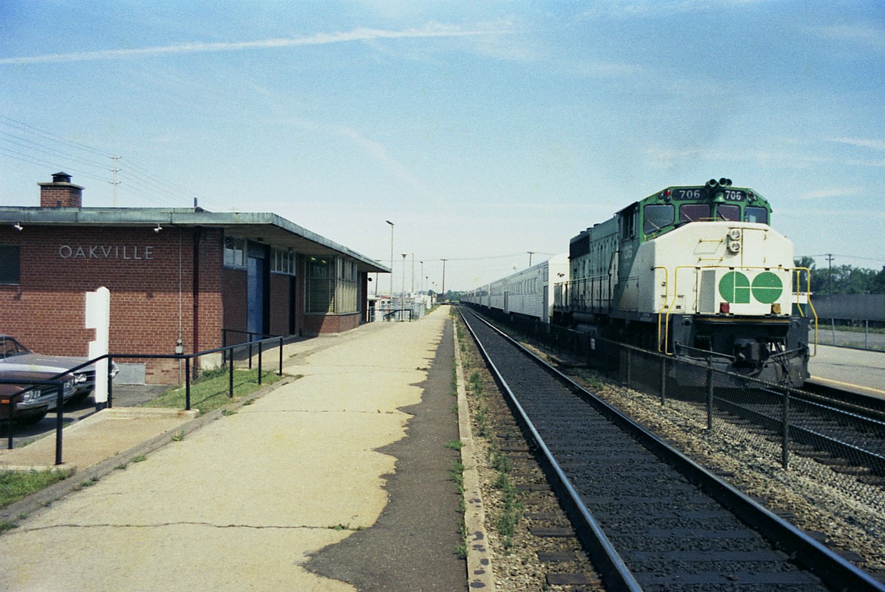 I barely recall taking this picture. And have forgotten the station.  GO 706 is the push-power on this Burlington-bound train, as seen in the days before bi-levels. Unfortunately I did not record the power car on the lead. Anyone know when this station was removed?