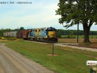 Passing by the "Rumble" household and farm, D724 "Rumbles" by on the CSX Sarnia Subdivision, at a leisurely 10 MPH having passed the "end OCS" sign for Blenheim and entered yard limits. CSX's RTC in Wallaceburg would give the OK for yard limits in Blenheim seeing that there might be conflicting movements with W.G. Thompson's switchers. I'm pleased to see current shots of CN in the area - I've still yet to make the trip since CSX sold to CN.