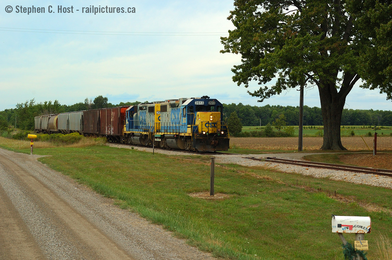 Passing by the "Rumble" household and farm, D724 "Rumbles" by on the CSX Sarnia Subdivision, at a leisurely 10 MPH having passed the "end OCS" sign for Blenheim and entered yard limits. CSX's RTC in Wallaceburg would give the OK for yard limits in Blenheim seeing that there might be conflicting movements with W.G. Thompson's switchers. I'm pleased to see current shots of CN in the area - I've still yet to make the trip since CSX sold to CN.