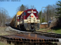 The oldest active engines on the Ontario Southland Railway roster - again, can you go wrong with a visit to the O.S.R at Salford? No, you can't. Built in 1951, and 1952, respectively, this matching pair of GP7's is seen hauling a train of autoracks from Woodstock in April passing a pile of rails used by the MOW team. These high nose geeps look smart in OSR paint, don't they.