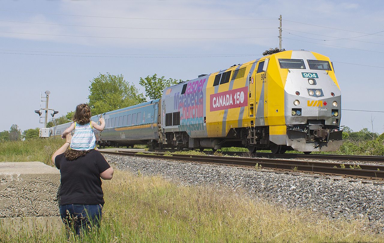 A FAMILY AFFAIR - Traditions never die!  It's amazing being a parent - especially of those memories that come back to you when you experience the wave from an engineer of a passing train, along with a couple of short toots on the horn as it glides by. My grandfather taught me of his love of trains, and I now get to share that with my daughter. But it doesn't just end there. I dedicate this photo to the dad's that work the long hours, as the engineer's of the road. And as mentioned already, to the grandafther's who have passed on their love of the railroad to their children, and continued the tradition with their grandchildren. And to the men who work for the railroad today, providing for your own families and creating new memories for kids of all ages. This photo is for you Dads - as I thank you all for taking the time to acknowledge us fans as you pass by. Happy Father's Day too! You have helped make new memories for me and my daughter. 

Side note: I had photographed 904 before outside of Paris just over a year ago. It was also a special moment then as it was  Dale Pringle's last run.