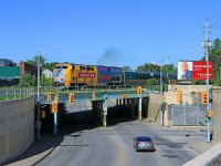 On the first day of summer, VIA 905, with Toronto bound train 72, gets underway from the station in Windsor.