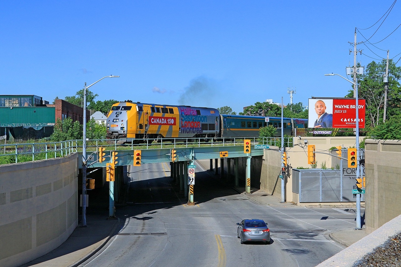 On the first day of summer, VIA 905, with Toronto bound train 72, gets underway from the station in Windsor.