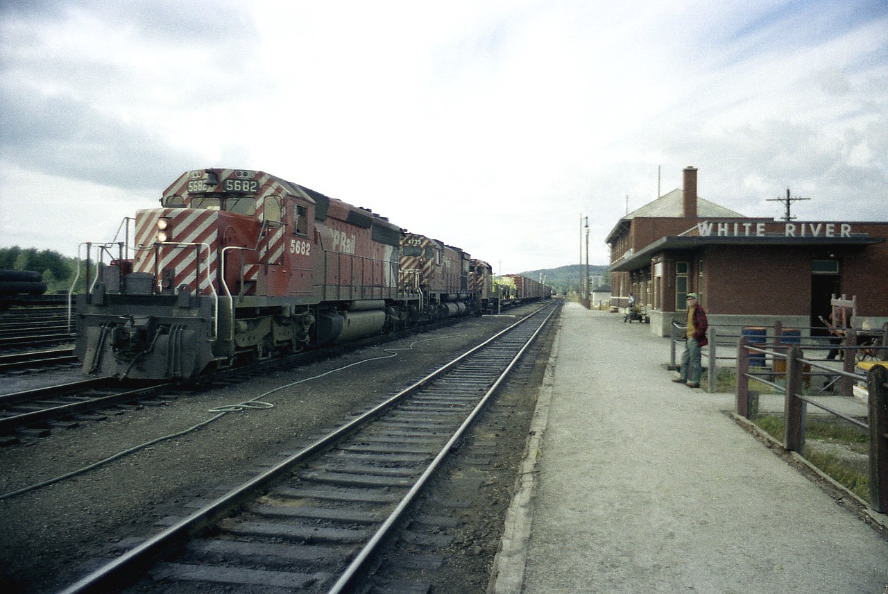 The only thing worse than shooting with cheap film on a grubby grey day is when it gets close to sunset and everything seems to take on a hue that makes it look even grubbier.  Thats how I felt this day, but waited out an eastbound which I was told was coming into White River. This town was never much to get excited about. Still isn't. But it was a logical place to stop overnight. Just one geezer on hand to watch CP 5682, 4735 and 5025 slow to a stop and a crew change. Now, some 40 years later; the station hasn't changed much at all, and probably neither has anything else.