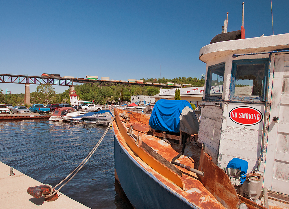 A lone ES44AC lugs a short by CN standard 5,994 ft Q107 over the CPR Trestle in Parry Sound.