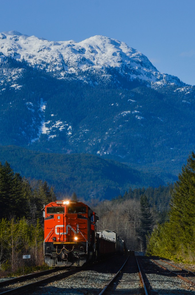 With a chilly outflow from Whistler blowing through Paradise Valley out to Howe Sound, CN's daily southbound for the for the former BCR lines south of Prince George (aka the Cariboo Division) rolls down the main at Cheakamus after spending an hour negotiating the Cheakamus Canyon.