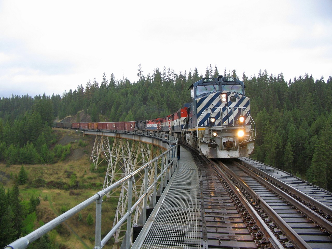 Another view on that dreary wet afternoon, a perfect day to stop the train for an image or two except for the weather. Mile 206 is in the middle of this bridge that spans Fifty One Creek.
Link to other image taken this day.
http://www.railpictures.ca/?attachment_id=30111