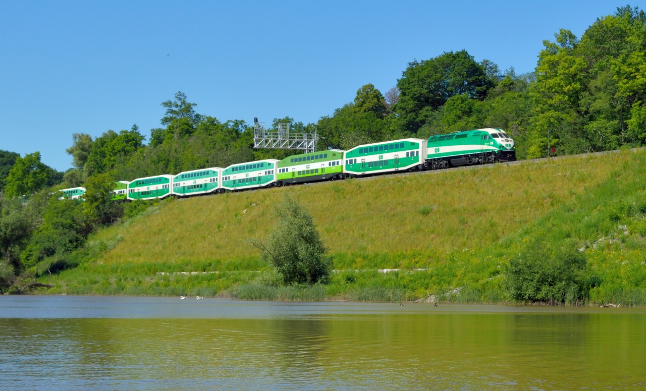 A GO Transit dead head move heads under one of two new signal bridges at Bayview to clear space at CP Hunter Street for the two extra trains bringing folks to and from a Rugby tournament being held at the Ti-Cats Stadium.