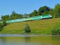 A GO Transit dead head move heads under one of two new signal bridges at Bayview to clear space at CP Hunter Street for the two extra trains bringing folks to and from a Rugby tournament being held at the Ti-Cats Stadium.