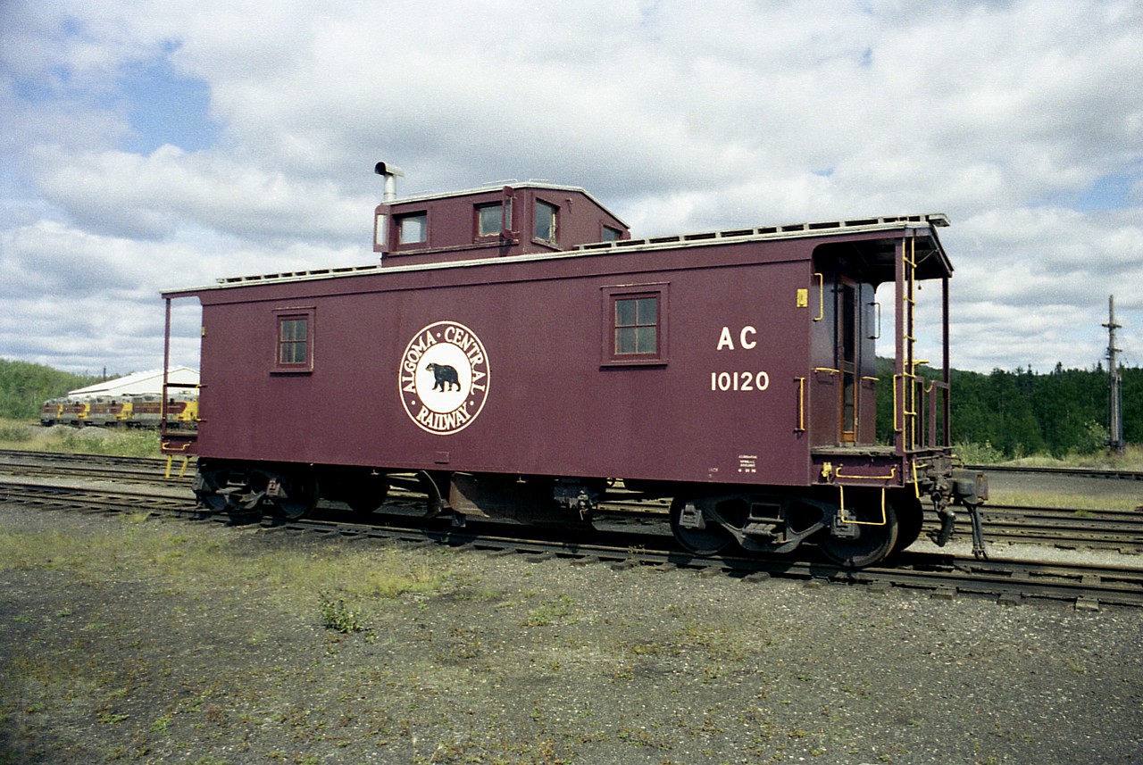 When visiting various railroads, once in a while an opportunity would present itself to grab a nice photo of something other than the road's power. This caboose is a great example. Sitting by itself north of the station and west of the shop (background on left) is AC 10120. Note this one has an underbody flanger blade. It might have been the only one of its' kind.