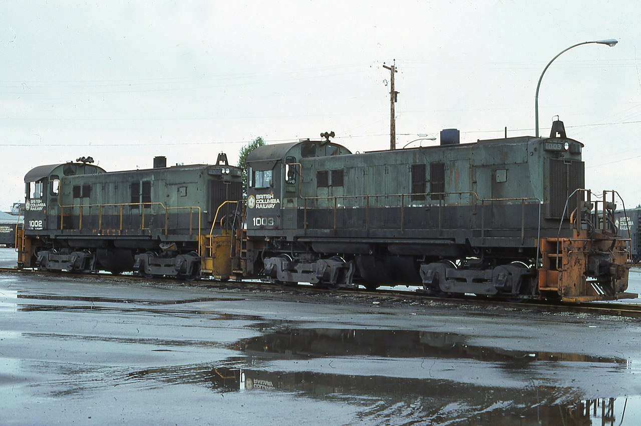 BCRail 1003, 1002 at North Vancouver Jul20/81, photo by Fred Gaines [ my collection ]. The 1002 is currently OSR 502 having arrived in Ontario looking pretty much the same as it did when Fred stood in the dreary west coast weather and captured it.