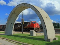 Framed by a portion of liner used in the construction of the St. Clair River Tunnel, CN 2850 and helper 2849 are U.S. bound at mile 59 on the CN's Strathroy Sub. Train number is unknown.