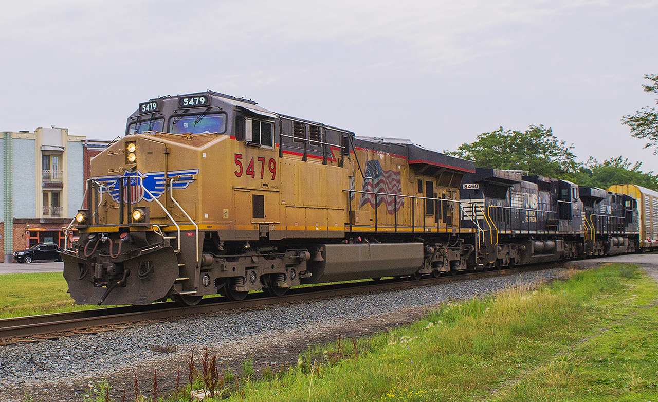 ONE  SWEET MOMENT!  After receiving a tip from  fellow rp.ca cotributor Luke Bellefleur  about this train coming through Chatham this morning, I normally wouldn't go out of my way to photograph it. When Luke told me that there was not one, but TWO Norfolk Southern engines helping to provide the power...No clouds could take away the excitement of seeing this lashup today! Because you never see that everyday!!! Bonus unit was UP 5479 in the lead of CP train 141.