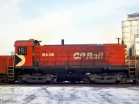 CP 6618, an MLW S11, is the local Goderich switcher as of this March 1974 photo (probably replacing <a href=http://www.railpictures.ca/?attachment_id=29867><b>CLC unit 17</b></a>). A pair of SW1200RS units are parked behind 6618, which were the power for the daily freight. The sign of Upper Lake Shipping is also visible, who was the owner of the elevator here (they also owned a fleet of lake boats from 1831 to 2011, then sold to Algoma Central).