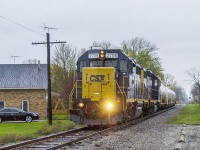<b> SOMETIMES YOU WIN...and sometimes you lose....</b> To sum it up, I had taken some vacation time off from work as I was kid free for the first week of May. I had planned this trip for sometime, and wanted to get back to this area to photograph not only VIA and CN, but the CSX as well. Boy, was I disappointed otherwise! 
<br>
<br>
Before this shot, it had actually stopped raining and had looked to be clearing. But as the train slowly moved towards me, the weather quickly changed as the rain just poured down while I waited. This was my main win of the day, which was  photographing this slow order train through Corunna that is led by CSX 2799 and a second unit that I did not wait in the rain to get the number for.