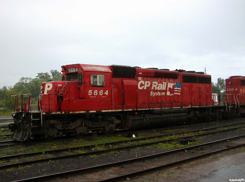 It was a rainy evening in MacTier as CP 5664 held down the head end of 435 staged for traffic. Now almost unheard of, it used to be fairly common for these lower priority trains to spend plenty of time sitting in crew change terminals across the NOSA. While usually found waiting for spare crews to come available on weekends, they also used to spend plenty of time waiting for faster traffic ahead to settle down before coming out with most of the switching to do online. This 435 had a few CP's and CN's ahead congesting the South end of the DRZ ahead of them, before departing later that evening with plenty of work to do at Britt, Romford and Sudbury on the way to Cartier.