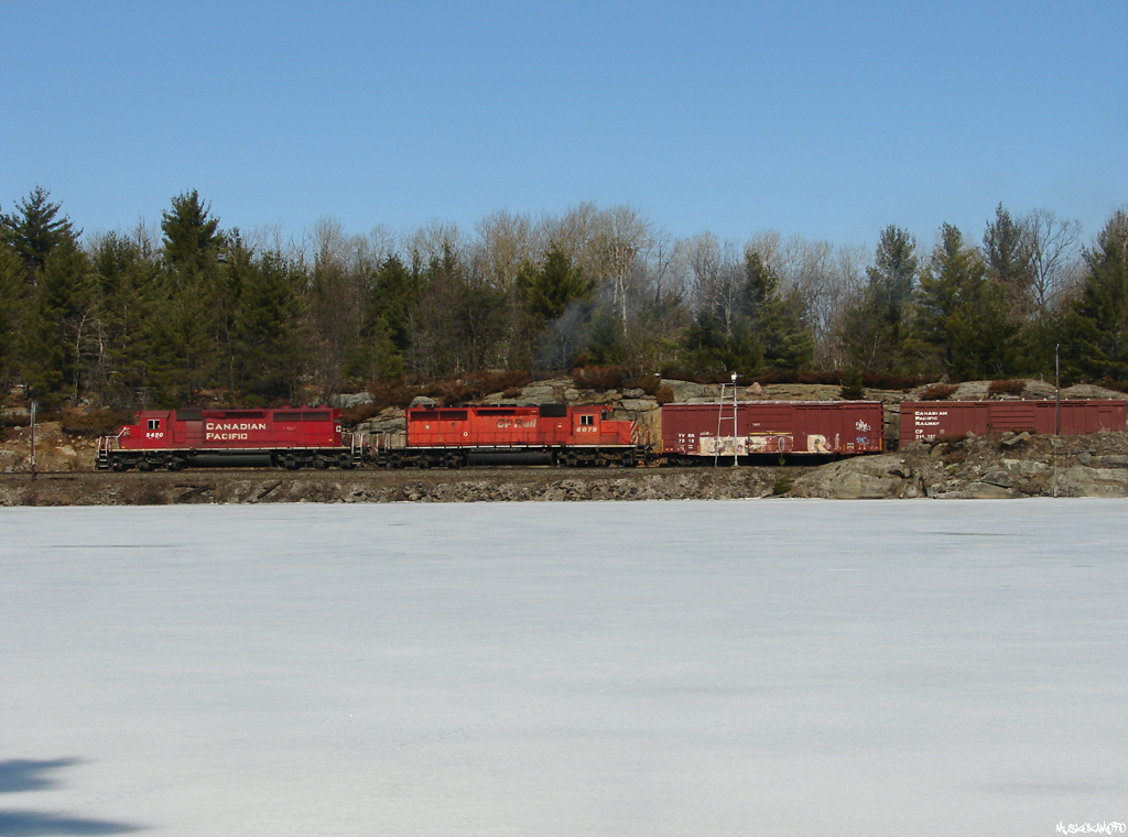 CP 5420 North departs North Siding Switch Bala with "The steel train" 437 to Sudbury after having met SOO 6033 South with 118. After a very sunny, nostalgic moment on the ice, I remember spending the walk back to the truck trying to remember what year it was! To see a photo of the SOO 6033 South, click here: http://www.railpictures.ca/?attachment_id=91