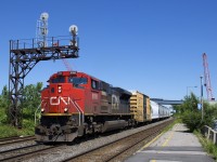 <b>One of four.</b> CN only has four SD70ACe's (all ex-demo's) and one of them (CN 8100) leads a 186-car CN 377 through Dorval, with CN 3076 operating mid-train. Interestingly enough one of the other four (CN 8103) led CN 368 through here just a couple of hours before.