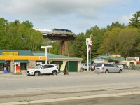 DH 7304 North crosses over downtown Pointe Au Baril spraying the weeds along the way to Sudbury. 