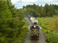 DH 7304 North spraying it's way Northwardsat Mile 50 Parry Sound sub enroute to Sudbury for the night. A long ways from home in the rugged shield of Central Ontario, 7304 looks right at home somehow! 