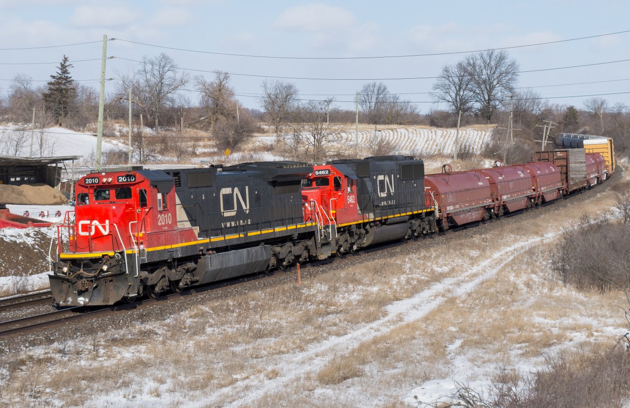 Back before CN abolished Sarnia to Port Robinson trains 330 and 331 we used to be treated to a mid day Westbound freight on the Dundas Sub daily.  331 was a freight that often ended up with interesting power and was an easy one to chase due to it working Paris Ontario to lift SOR traffic.  On February 11, 2016 I found myself standing at Copetown Ontario waiting on 331 with CN 2010 and CN 5462, a pair of standard cabs...not too shabby.  As soon as the head end passed me I highballed for Garden Avenue, beating them there by 5 minutes for a second shot.