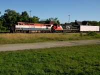 A pair of very different dash 8's pull CN 434 through Ingersoll