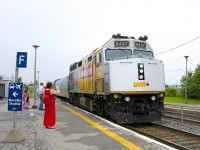 <b>Happy Canada Day!</b> One of only five VIA Rail F40's in a Canada 150 wrap (with one of them stranded in Churchill) brings VIA 624 into Dorval Station on an overcast Canada Day as my wife and daughter look on. Wrapped F40 VIA 6436 had arrived here just ten minutes before leading VIA 60.